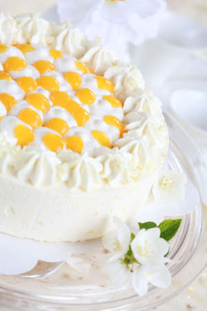 Delicious yogurt cake with oranges and creamの写真素材