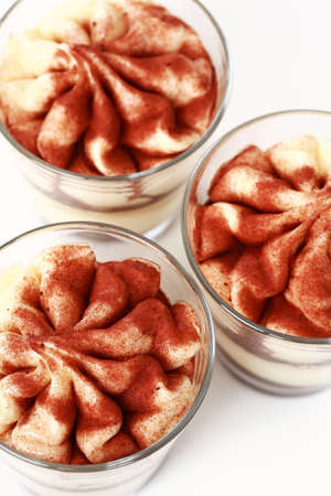 Three Tiramisu desserts in the cupの写真素材