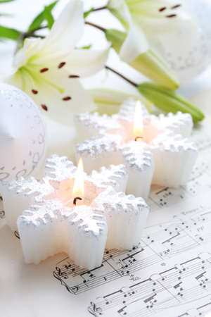 Christmas still life with candles and music notesの写真素材