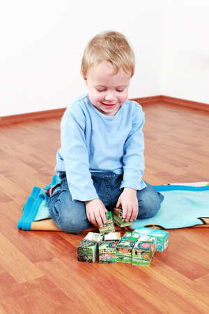 Lovely boy playing with blocksの写真素材