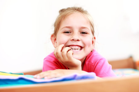 Beautiful small girl is smiling  sincerely 