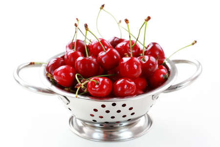 Fresh cherries in the bowl on white backgroundの写真素材