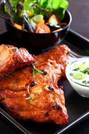 Spare ribs with vegetable and sour creamの写真素材