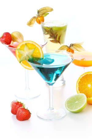 Different cocktails or longdrinks garnished with fruitsの写真素材