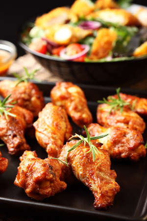 Hot chicken wings on baking trayの写真素材