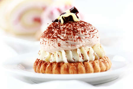 Sweet whipped cream cake with chocolateの写真素材