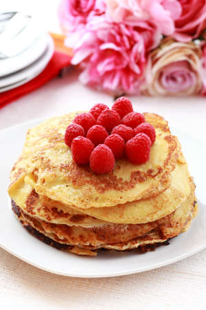 Sweet pancakes with fresh raspberriesの写真素材