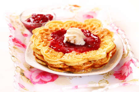Waffles with fresh strawberry jam and whipped creamの写真素材
