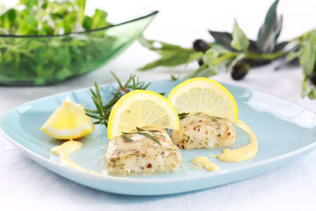 Baked hake with olive oil and rosemaryの写真素材