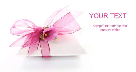 Small gift box decorated with ribbon and flower with copy space for your textの写真素材