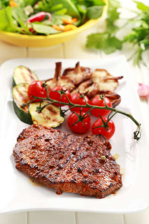Beef steak with grilled vegetable and mushroomsの写真素材