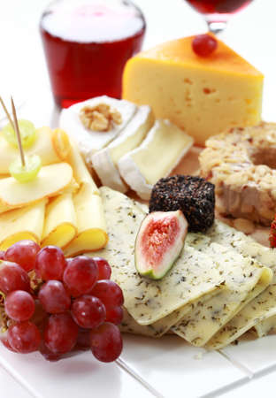 Catering cheese platter with red wineの写真素材
