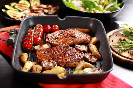 Delicious beef steak with grilled vegetable and mushroomsの写真素材