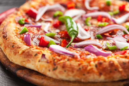 Tradition Mexican pizza with chili, salami and onionの写真素材