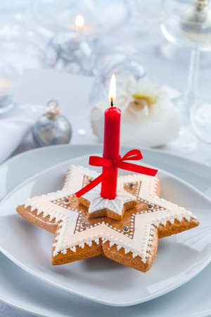 Still life with delicious gingerbread with red candle for Christmasの写真素材