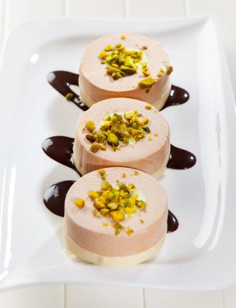 Delicious small cream cakes with pistachio