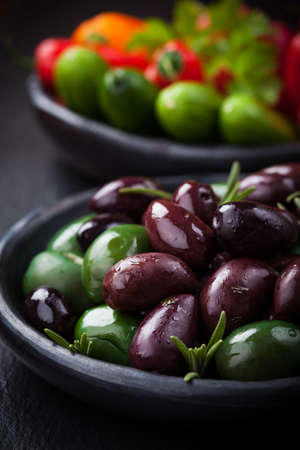Mixed olives with raw snack vegetable as antipastiの写真素材