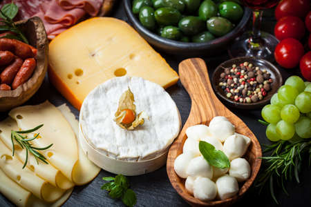 Antipasto and catering platter with different meat and cheese productsの写真素材