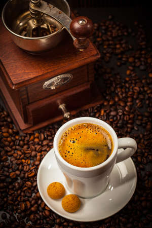 Espresso cup with coffee mill and beansの写真素材
