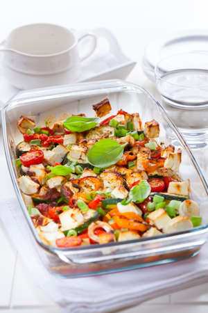 Baked vegetable with sheep cheese and herbsの写真素材