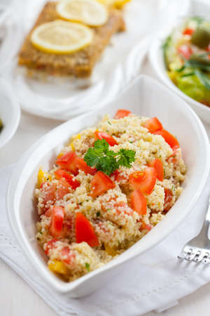 Couscous salad with tomato, pepper with olivesの写真素材