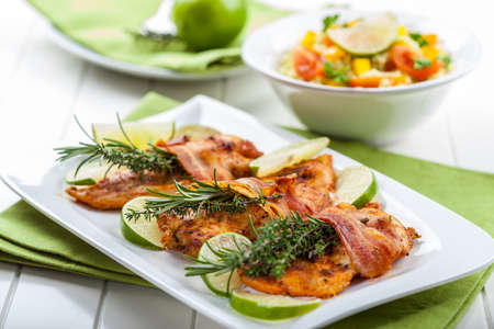 Chicken breast with herbs and couscous saladの写真素材