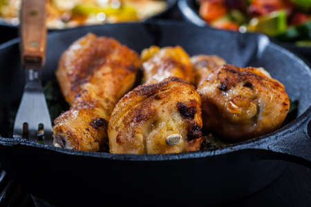 Crispy chicken legs in a panの写真素材