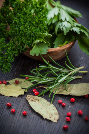 Fresh herbs and spices on wooden tableの写真素材