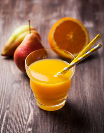 Delicious and healthy homemade smoothie with orange and pearsの写真素材