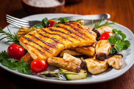 Halloumi grilled cheese on mushrooms and vegetablesの写真素材