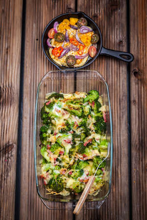 Baked broccoli with tomato saladの写真素材