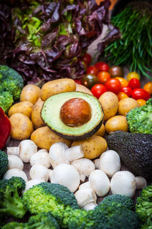Assorted raw vegetables on wooden backgroundの写真素材