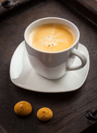 Cup of coffee on wooden tableの写真素材