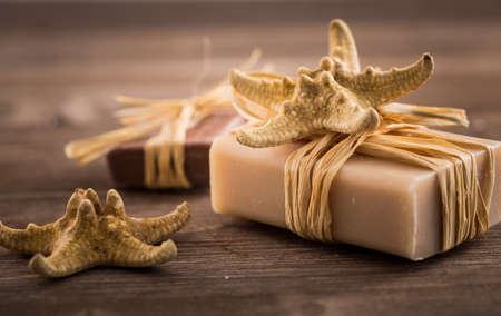Bars of handmade soap on wooden backgroundの写真素材