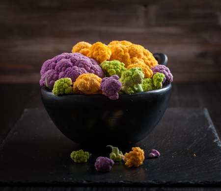 Assortment of organic cauliflower from local market on wooden backgroundの写真素材