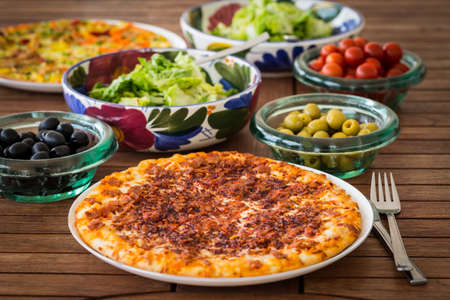 Spanish pizza with   Iberian ham and salatの写真素材