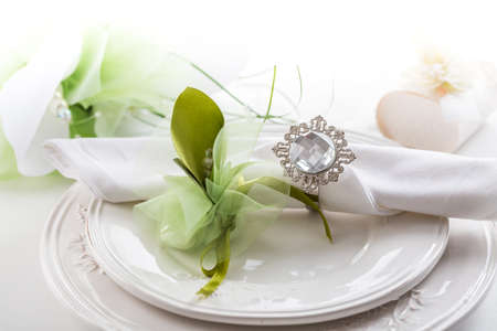 Festive table setting with small  bouquet on plateの写真素材