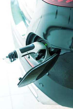 Detail of electric car in charging stationの写真素材