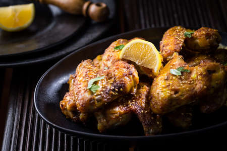 Spicy chicken wings with garlic, sesame and lemon marinade in Asia styleの写真素材