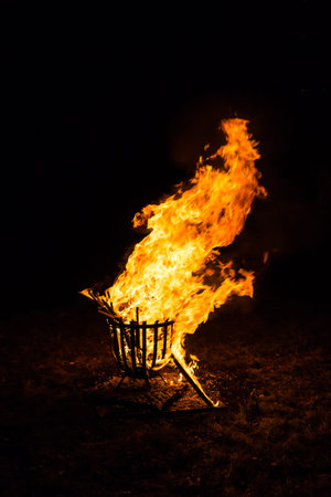 Real fire flames in fireplace. Outdoor fireplace.