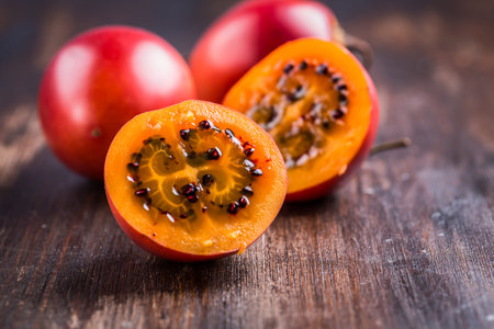 Fresh tamarillo fruit on wooden background