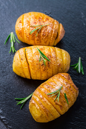 Hasselback potatoes. Backed potatoes from Sweeden with garlic and herbs grilled in the oven.