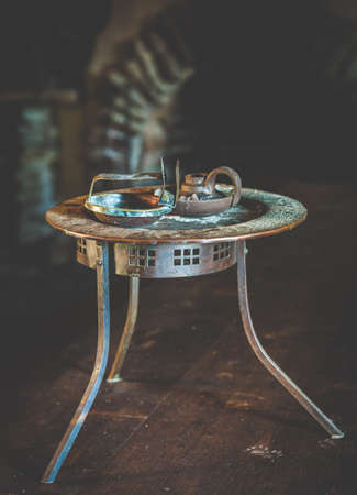 Vintage rusty table with candle holders in vintage style の写真素材