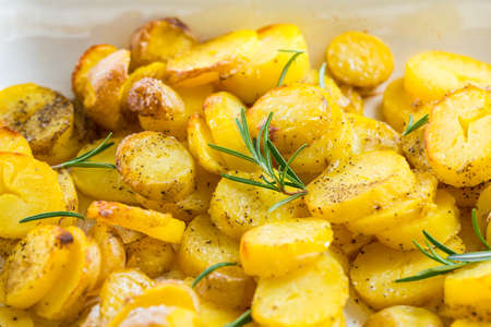 Fried potatoes in baking sheetの写真素材
