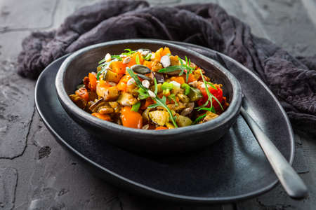 Low carb salad of grilled vegetables with rocket (arugula) and  seedsの写真素材
