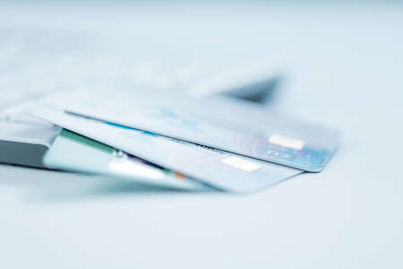 Bank creadit cards on keyboard. Concept of online banking and internet purchase. Soft focus.の写真素材