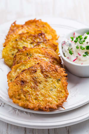Fried potato  pancake with radishes cream cheese and chives. Vegetarian food concept,の写真素材