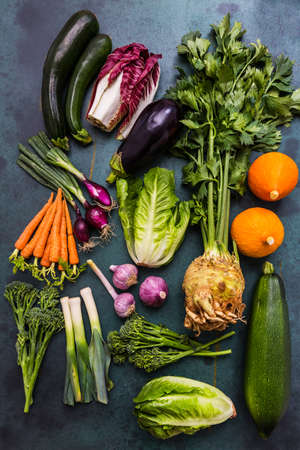 Assortment of healthy vegetables and ingredients for healthy and diet cooking on green backgroundの写真素材
