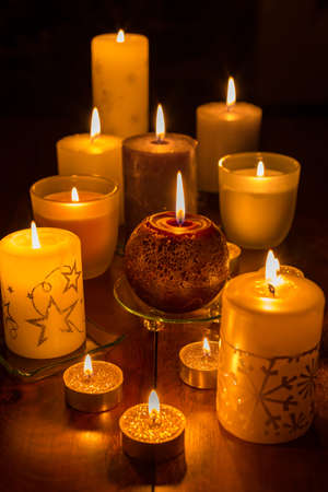 Candles on wooden background. Candlelights for Christmas.の写真素材