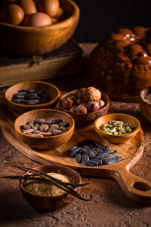 Different baking ingredients, spices and kitchen utensils in vintage style. Christmas baking concept.の写真素材